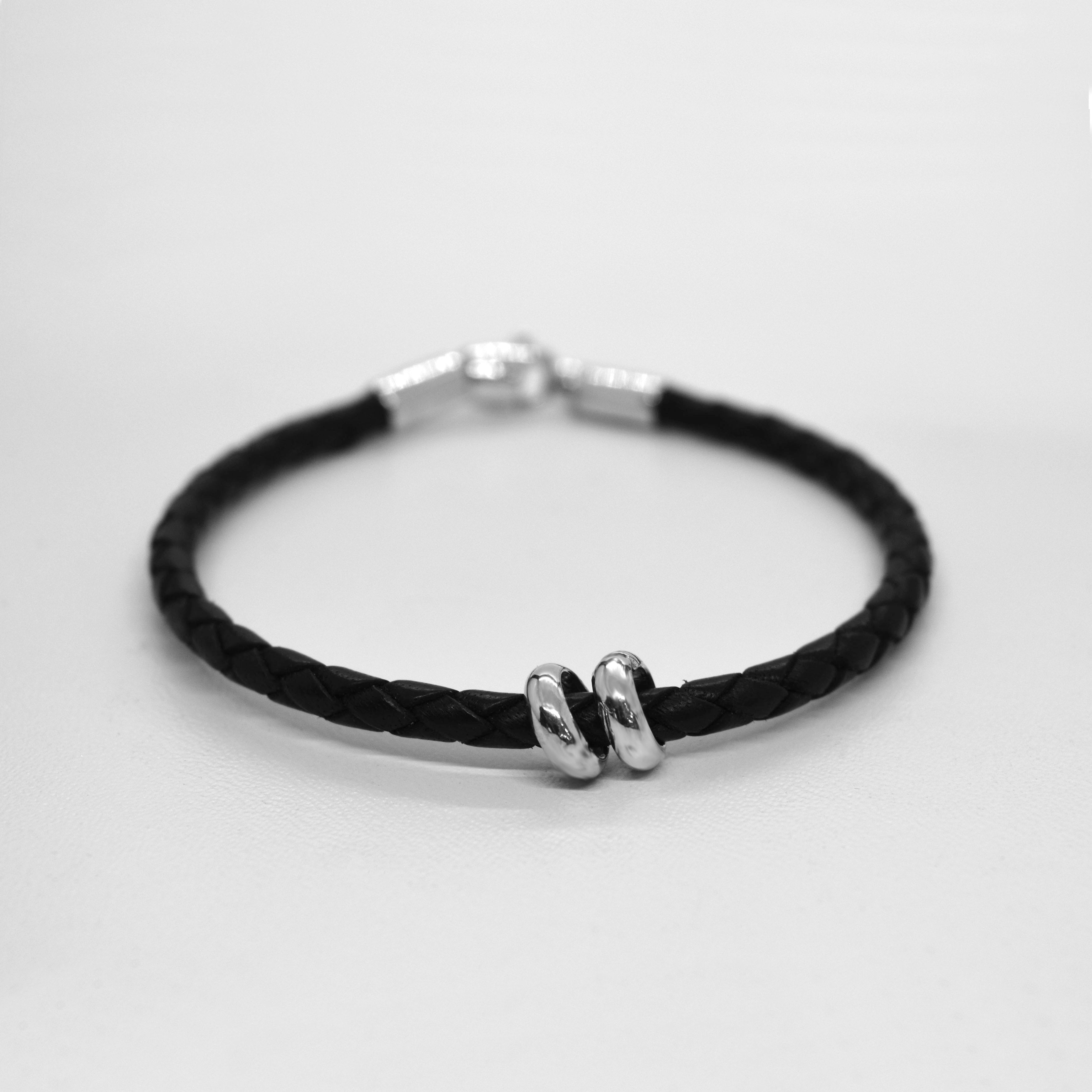 Braided leather bracelet with charms