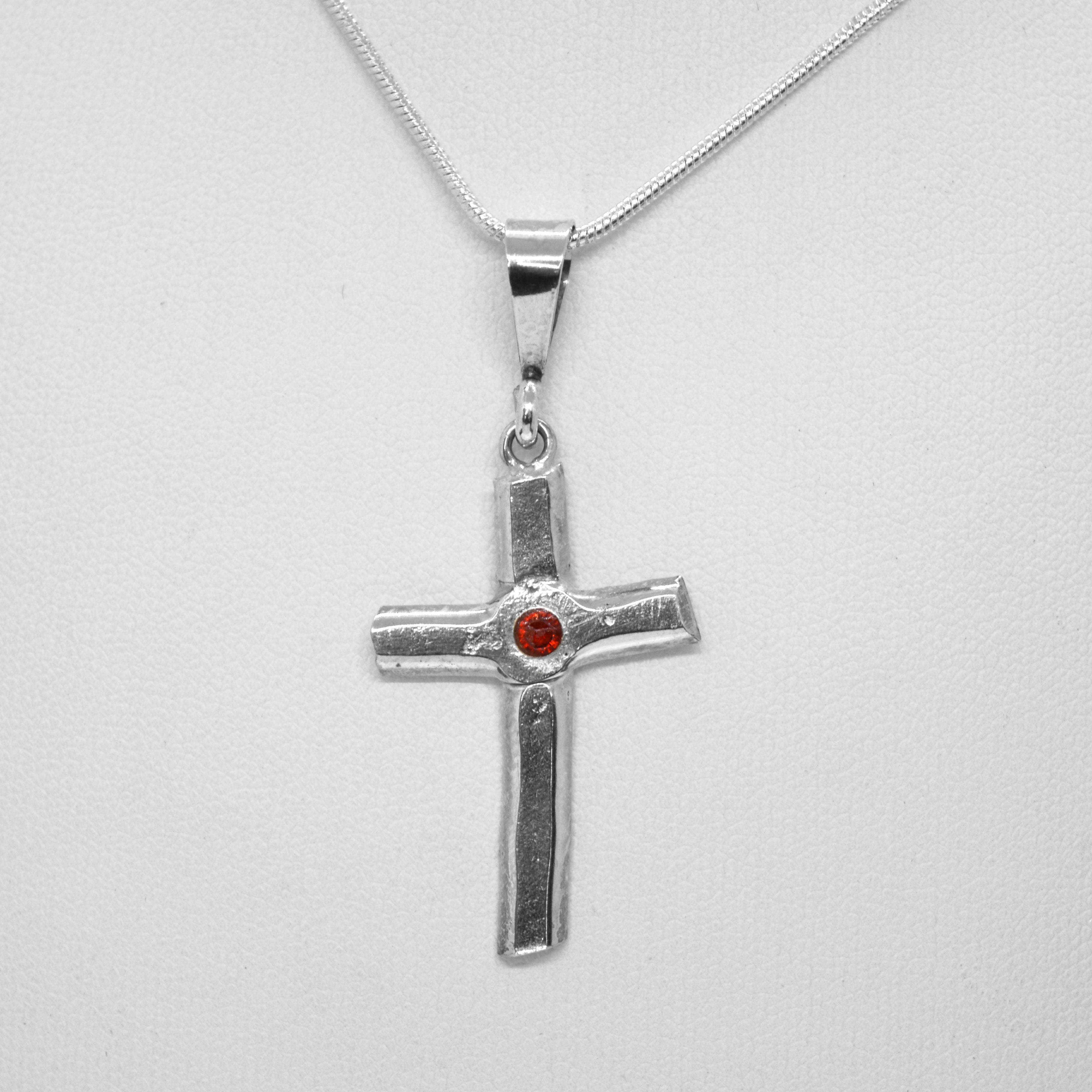 Cross with set in gemstone